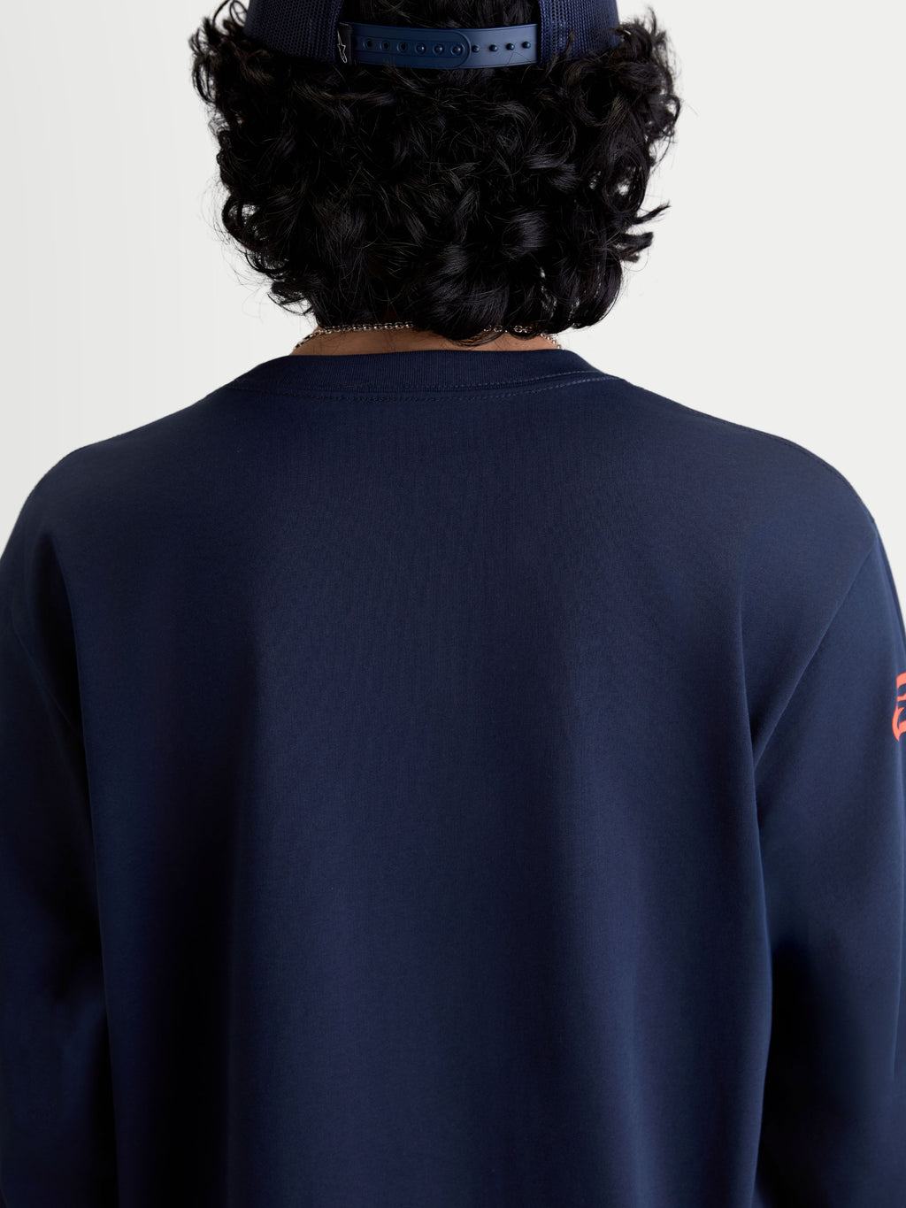 Alpinestars Velocifier CSF Tee, Long Sleeve Sportswear T-Shirt in Navy Blue, back view on model featuring a ribbed crew neck, motorsport-inspired casual apparel made from a soft cotton and recycled polyester blend.