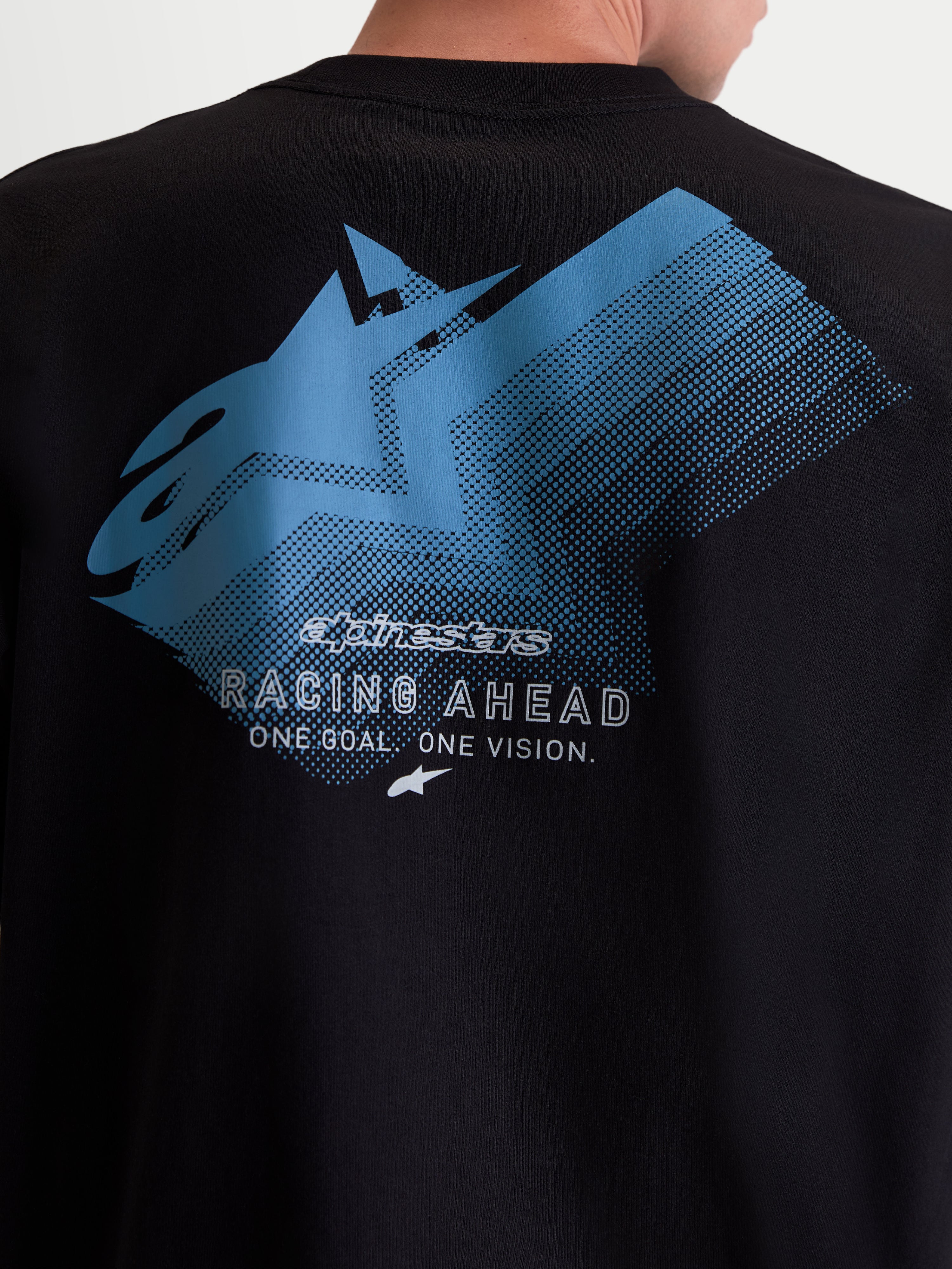 Alpinestars Ghost Oversized CSF Tee, Unisex Sportswear T-shirt, Black and Blue, featuring a fade logo back graphic with Racing Ahead and One Goal One Vision branding, relaxed fit Cotton-Poly blend, back view close-up.