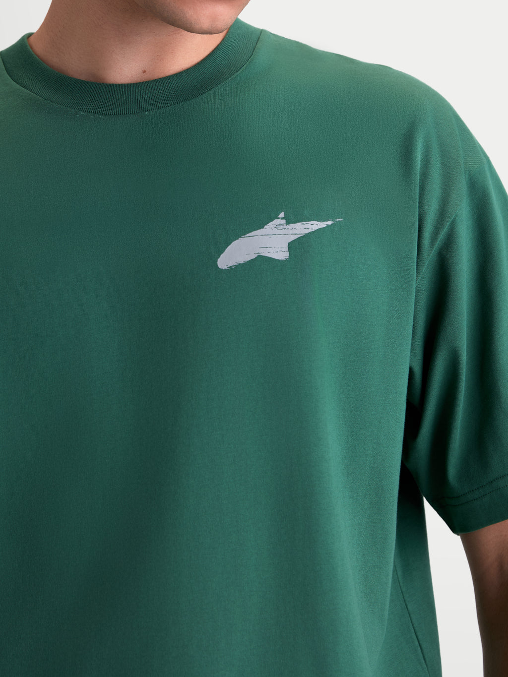 Alpinestars Checkback Oversized CSF Tee, Green Short Sleeve Sportswear T-shirt, Unisex, close-up view showing the white Astars logo on the chest, oversized fit, soft-hand print finish, premium cotton-poly blend.