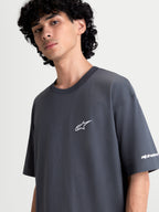 Alpinestars Mandate Oversized CSF Tee, Charcoal Gray Short Sleeve Sportswear T-shirt, Relaxed Oversized Fit, featuring a White Puff-Print Astars Logo and Sleeve Branding, Soft Cotton-Poly Blend construction.