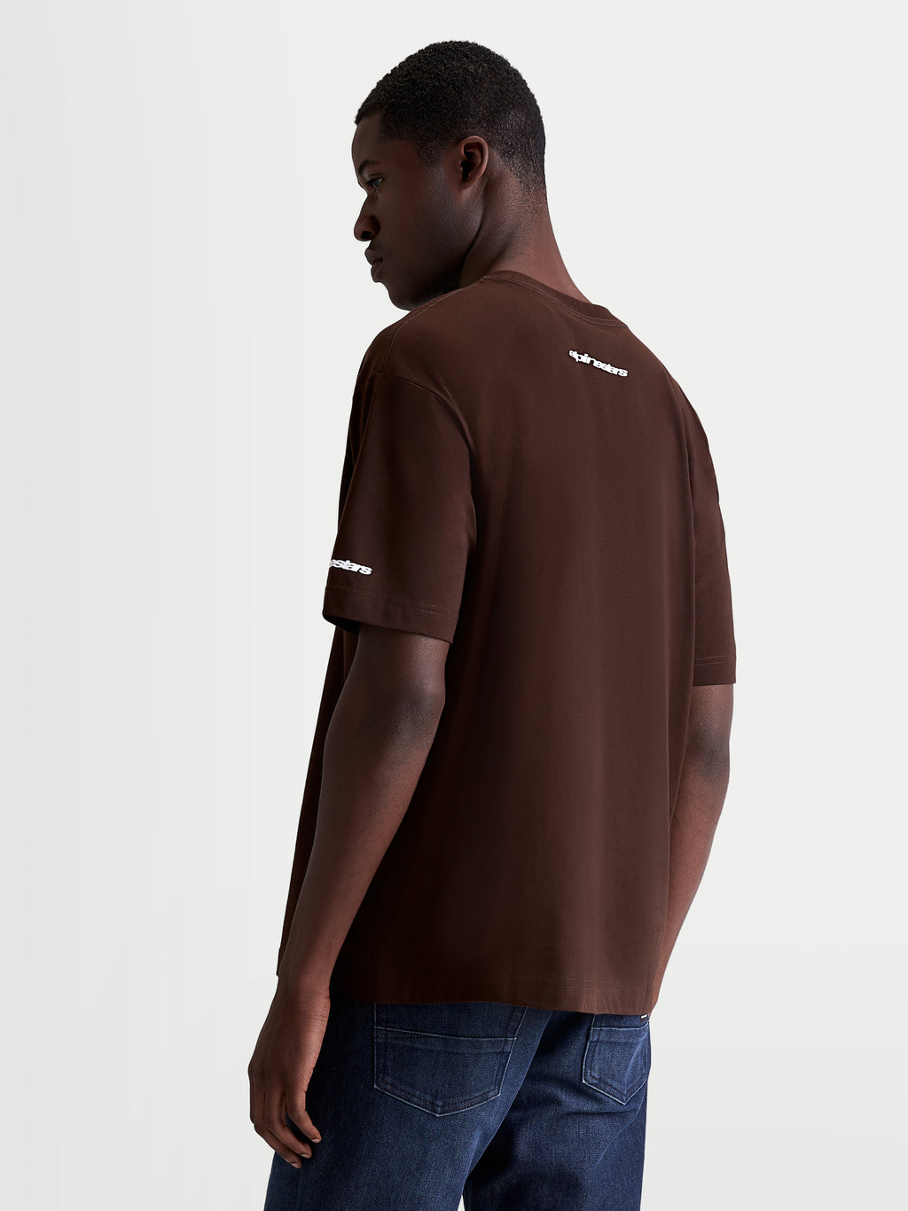 Alpinestars Mandate Oversized CSF Tee, Men's Short Sleeve Sportswear T-Shirt, Brown with White puff-print wordmark on back shoulder and sleeve, relaxed oversized fit, durable cotton-poly blend construction.