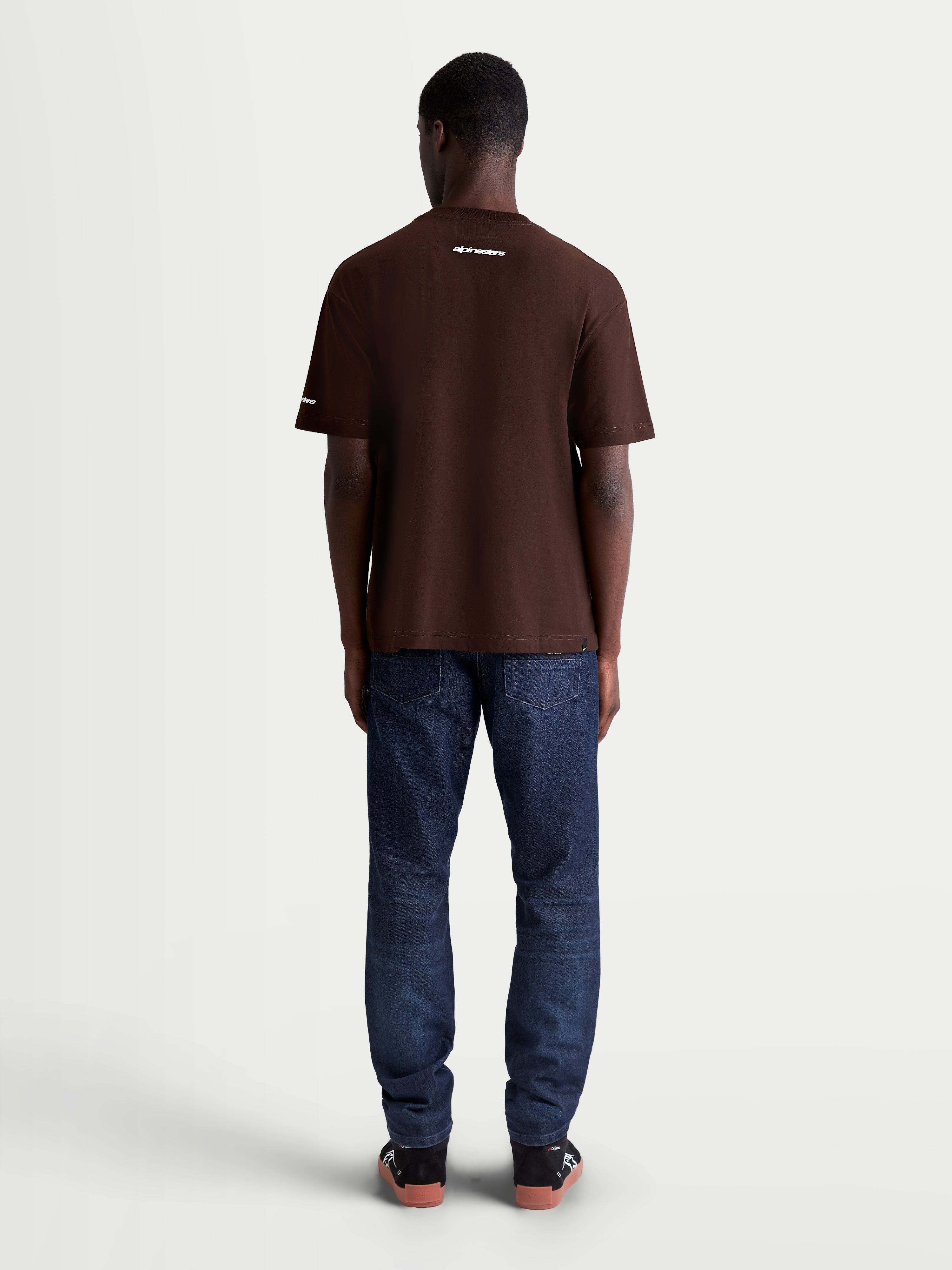 Alpinestars Mandate Oversized CSF Tee, Men's Short Sleeve Sportswear T-Shirt, Brown, Relaxed Oversized Fit, White Wordmark Logo on Back, Back View on Model