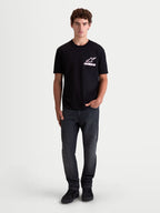 Alpinestars Koszulka Lineout CSF, męska koszulka z krótkim rękawem, czarna z biało-różową grafiką logo Astars, odzież sportswear, widok na modelu, mieszanka bawełny i poliestru.