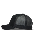 Alpinestars Augment Trucker Hat in Black, side view with a twill front, curved bill, and breathable diamond mesh back.