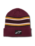 Alpinestars Bolted Cuff Beanie, bordowa czapka zimowa z prążkowanej dzianiny, poziome paski w kolorach złotym, czarnym i białym, wywinięty mankiet z tkaną naszywką z logo Alpinestars, sportowe nakrycie głowy