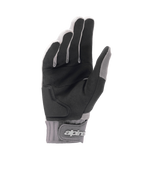 Rękawiczki Alpinestars A-Dura Gel, jasnoszare i czarne rękawiczki na rower górski, widok od strony dłoni przedstawiający czarny syntetyczny zamsz z żelową wyściółką, neoprenowy mankiet z zapięciem na rzep i logo marki, ergonomiczny sprzęt kolarski