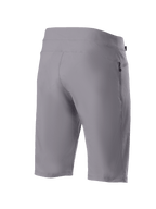 Alpinestars A-Dura Shorts, spodenki rowerowe MTB, ciemnoszare, widok z tyłu pod skosem ukazujący wytrzymały, rozciągliwy w dwóch kierunkach materiał oraz boczną kieszeń zapinaną na zamek, techniczna odzież rowerowa