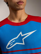Koszulka Alpinestars A-Dura Elite 2.0, niebiesko-czerwony top MTB z białym logo gwiazdy na piersi.