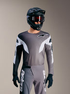 Koszulka MTB A-Supra Elite Faded Gray, mikroperforowany top z białymi akcentami i brandingiem Alpinestars.