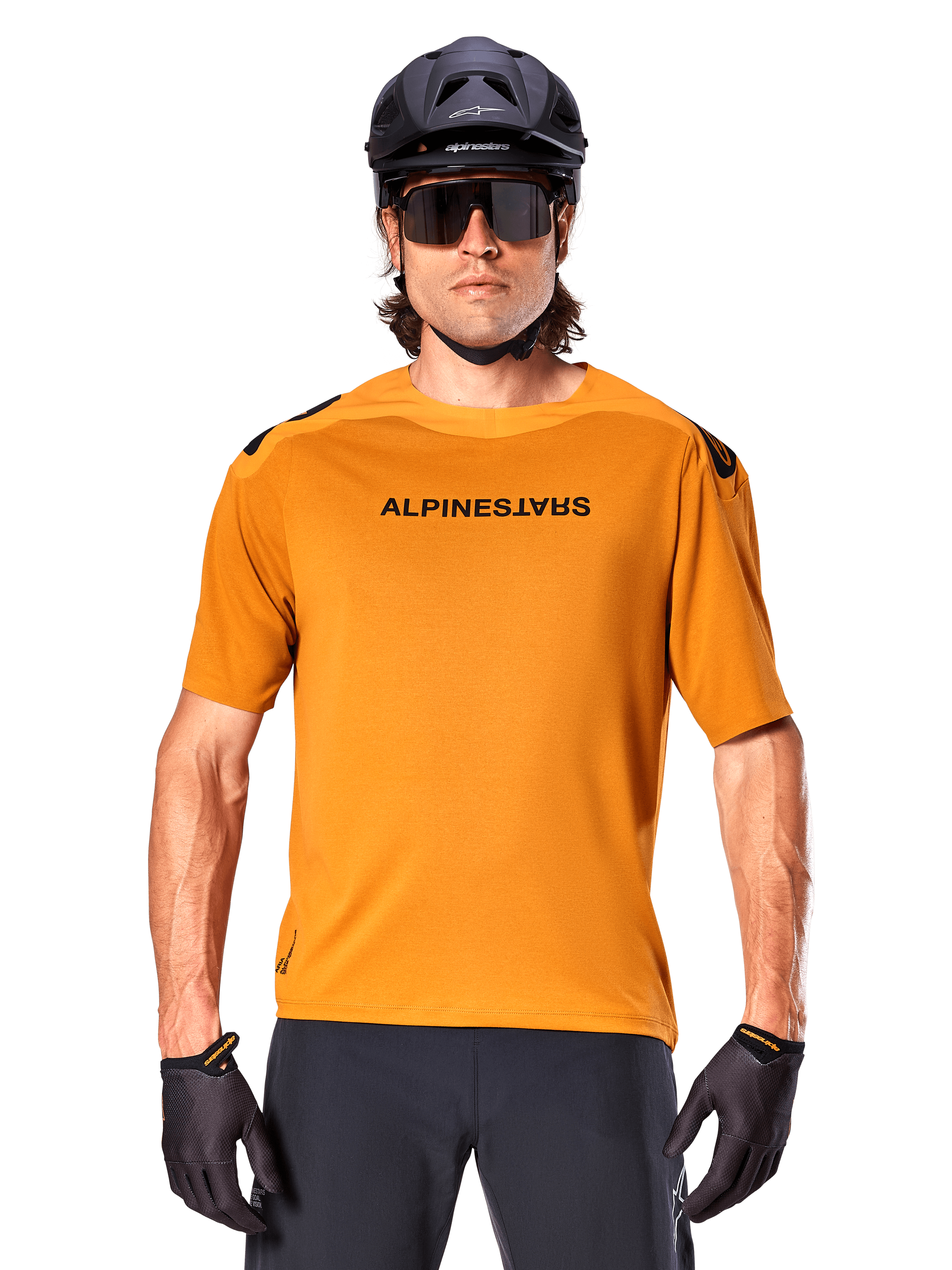 Alpinestars A-Aria Polartec Switch Jersey - Short Sleeve, Dark Gold, mountain bike rider wearing black helmet and sunglasses, performance cycling apparel for MTB trails