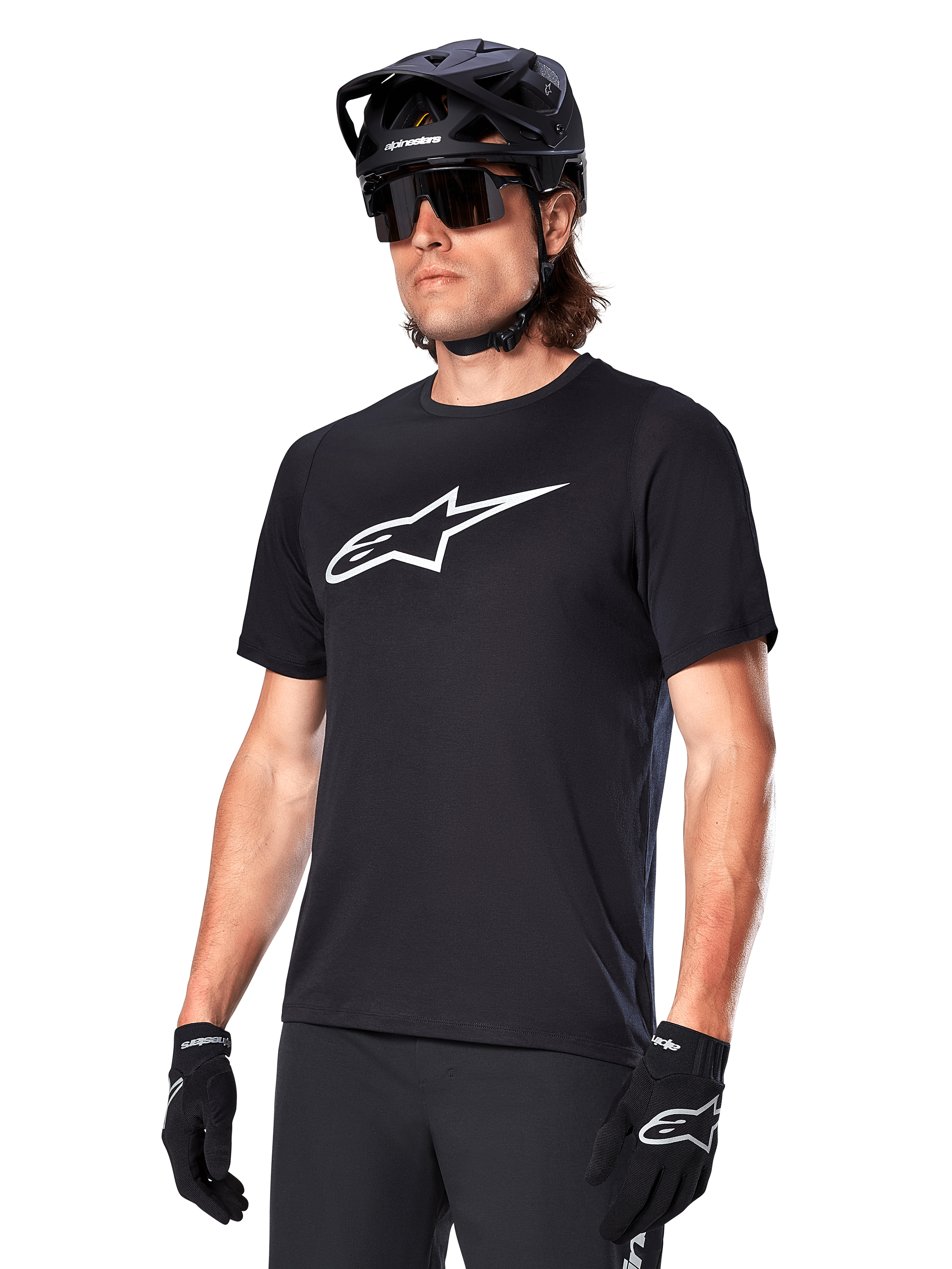 Alpinestars A-Dura Dri Oscar Jersey, Short Sleeve MTB Cycling Shirt, Black with white logo, moisture-wicking performance fabric, worn with black helmet, sunglasses, and gloves