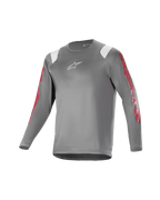 Alpinestars Youth A Supra Astar Long Sleeve Jersey, młodzieżowa koszulka z długim rękawem, ciemnoszara z białymi akcentami na ramionach i czerwonymi oznaczeniami na rękawach, białe logo na klatce piersiowej, oddychający materiał techniczny, okrągły dekolt, sportowy krój do jazdy na rowerze górskim