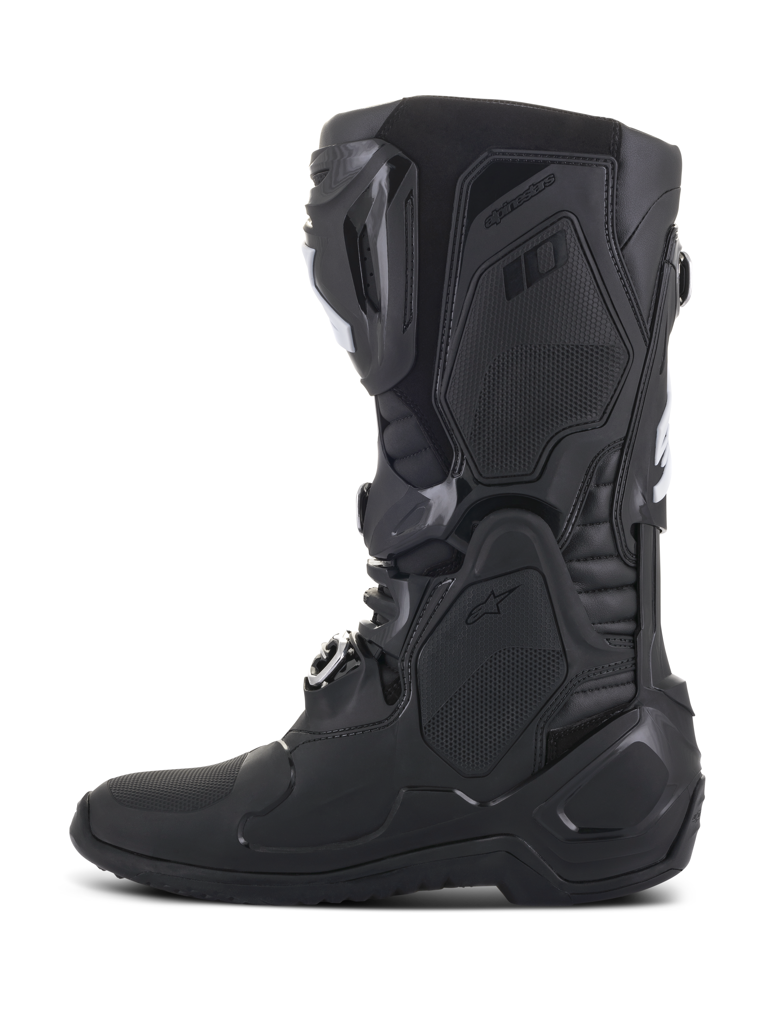 Buty Alpinestars Tech 10, czarne buty motocrossowe, widok z boku, zaawansowana konstrukcja skorupy TPU, smukły design z zapięciami na klamry i teksturowane panele ochronne dla profesjonalnej wydajności w wyścigach terenowych