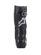 Buty Alpinestars Tech 10, czarne, widok z tyłu z białym logo gwiazdy na łydce, wytrzymała skorupa TPU i konstrukcja z mikrofibry, przeznaczone do wyczynowego motocrossu i jazdy terenowej