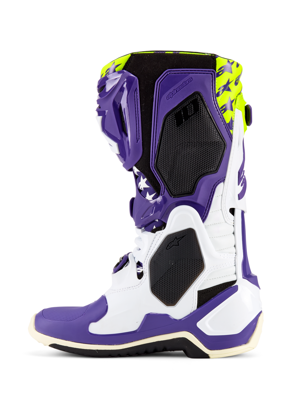 Buty Alpinestars Tech 10 Dirt Studios® LE, buty motocrossowe, białe, fioletowe i żółte neonowe, widok z boku prezentujący biało-fioletowy szkielet TPU, neonowo żółtą górę z grafikami gwiazd, czarne panele o teksturze plastra miodu oraz profesjonalny design wyścigowy off-road