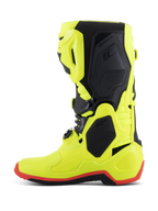 Buty Alpinestars Tech 10, buty motocrossowe, żółte fluo, czarne i czerwone fluo, profil boczny, jaskrawa neonowożółta konstrukcja z czarnymi panelami ochronnymi i czerwonymi detalami podeszwy, profesjonalny sprzęt do wyścigów terenowych
