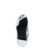 Buty Alpinestars Tech-10, podeszwa motocrossowa, czarna i biała, wymienna wkładka i logo z gwiazdą.