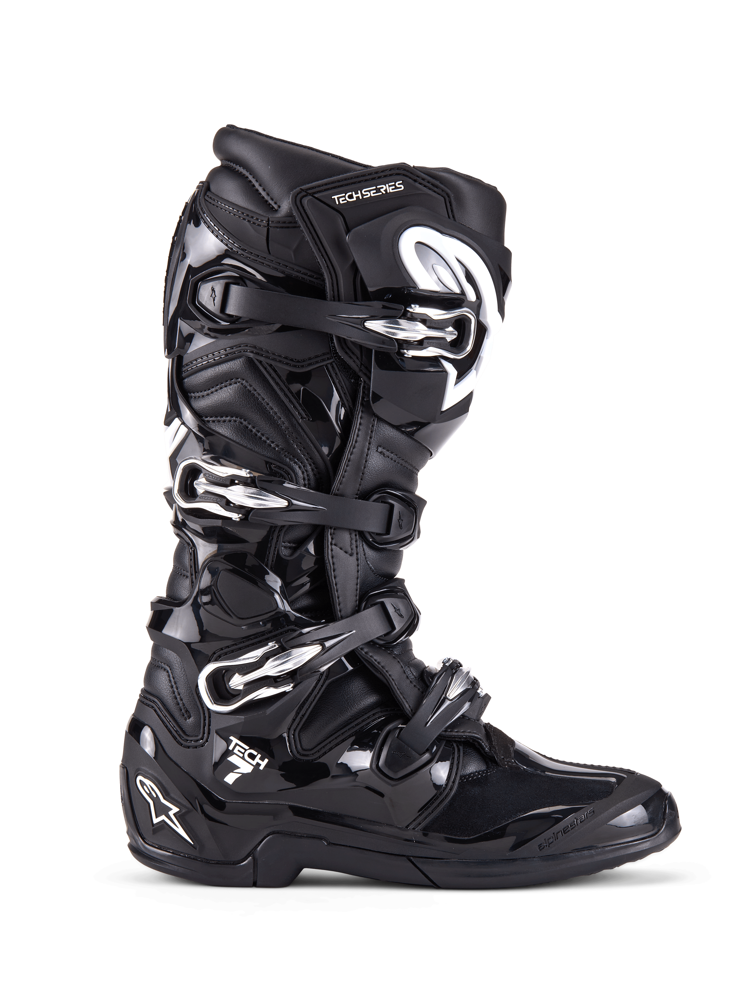 Buty Alpinestars Tech 7, buty motocrossowe off-road, czarne ze srebrnymi klamrami i białymi akcentami, widok z boku z czterema aluminiowymi klamrami, wytrzymała skorupa TPU i teksturowane panele zapewniające ochronę w terenie