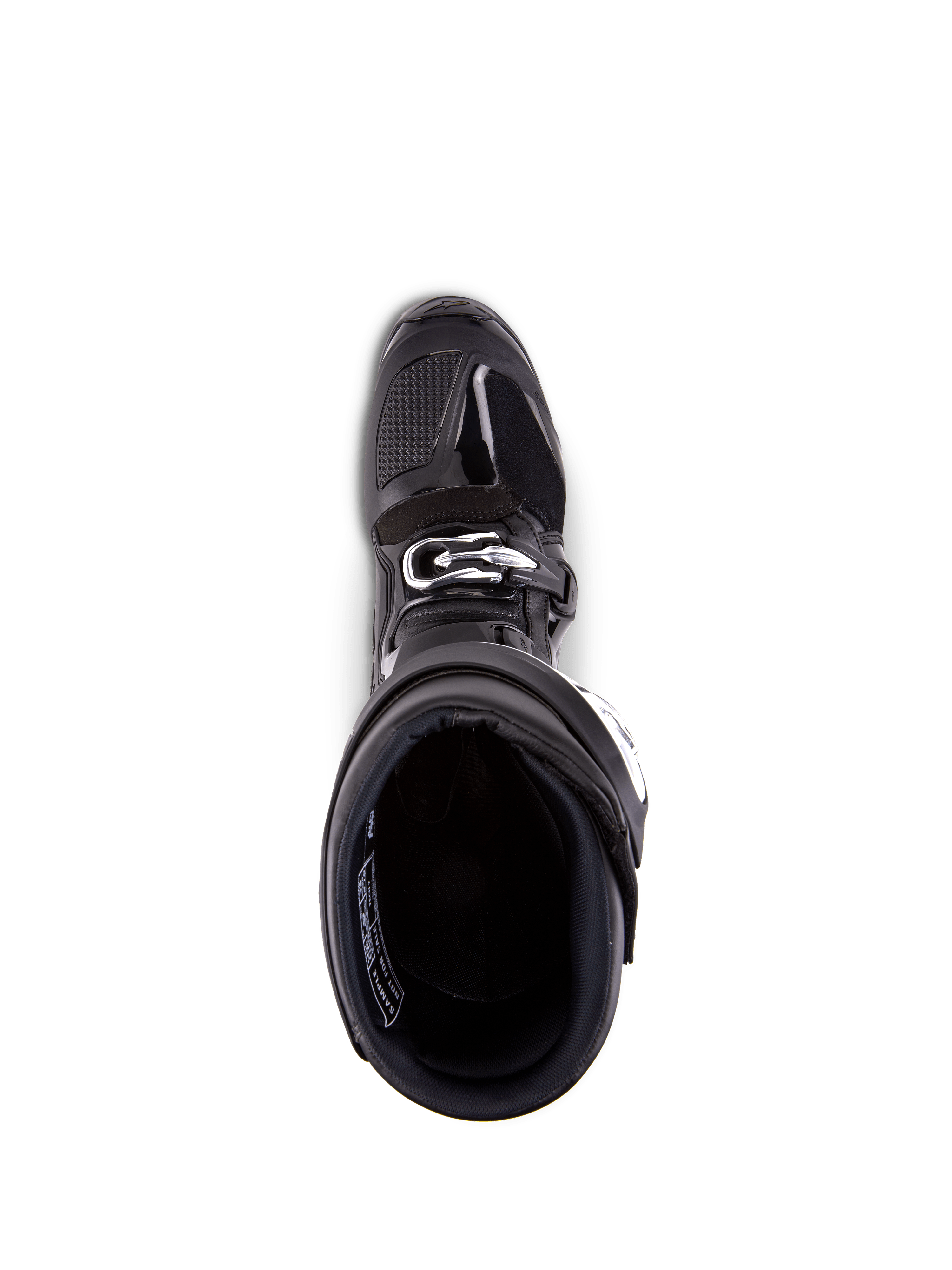 Buty Alpinestars Tech 7, buty motocrossowe, czarne, widok z góry na wyściółkę wewnętrzną, ze srebrnym zapięciem na klamrę i wzmocnionym obszarem palców, profesjonalne obuwie wyścigowe off-road.