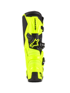 Buty motocrossowe Alpinestars Tech 7, żółte fluo i czarne, widok z tyłu ukazujący ochronną konstrukcję TPU i osłonę pięty, wyraźne logo Alpinestars, jaskrawy design o wysokiej widoczności zapewniający wydajność w terenie