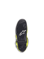 Buty Alpinestars Tech 7, buty motocrossowe, żółty fluo i czarny, widok od dołu na czarną gumową podeszwę z teksturowanym wzorem bieżnika, białe logo gwiazdy i czerwony wskaźnik zużycia zapewniający trwałość w terenie