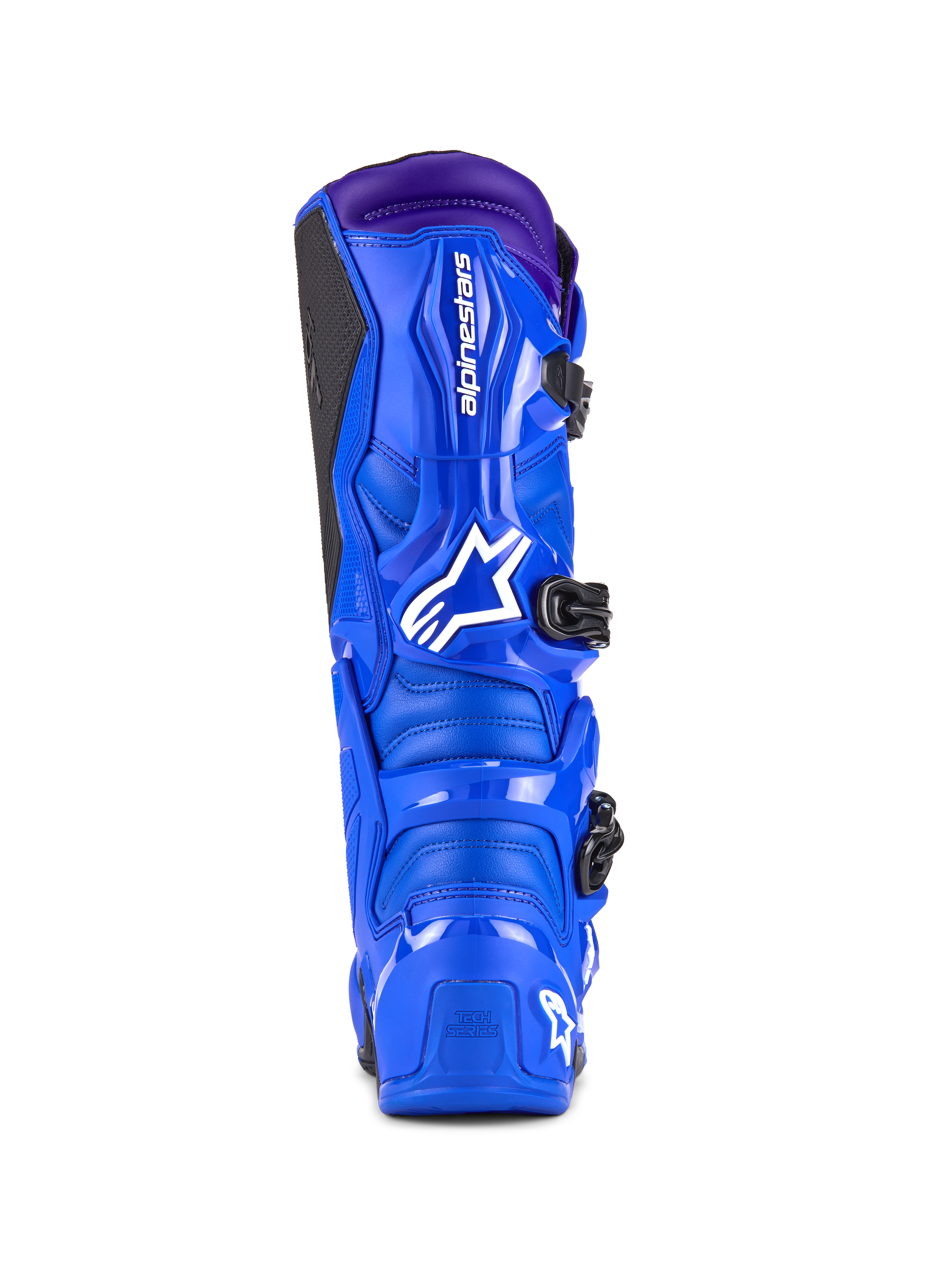 Buty Alpinestars Tech 7, buty motocrossowe, niebieskie z fioletowymi akcentami, widok z tyłu przedstawiający ochronę TPU, białe logo Alpinestars na pięcie i czarny boczny panel przyczepny, wysokiej klasy obuwie terenowe