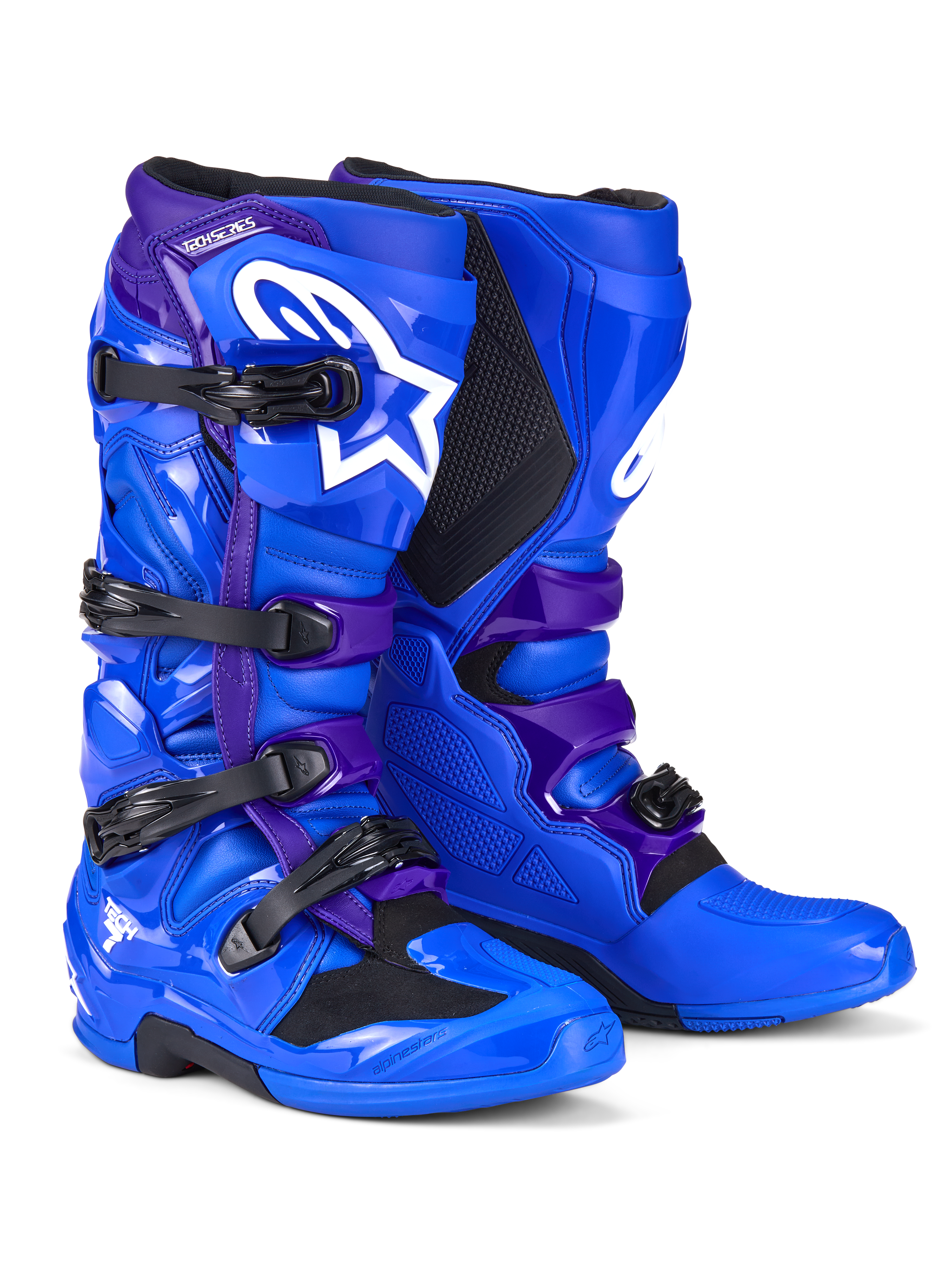 Buty Alpinestars Tech 7, buty motocrossowe, niebieskie i fioletowe, białe logo Alpinestars, panele ochronne TPU, system zapinania na cztery klamry, wytrzymała podeszwa terenowa