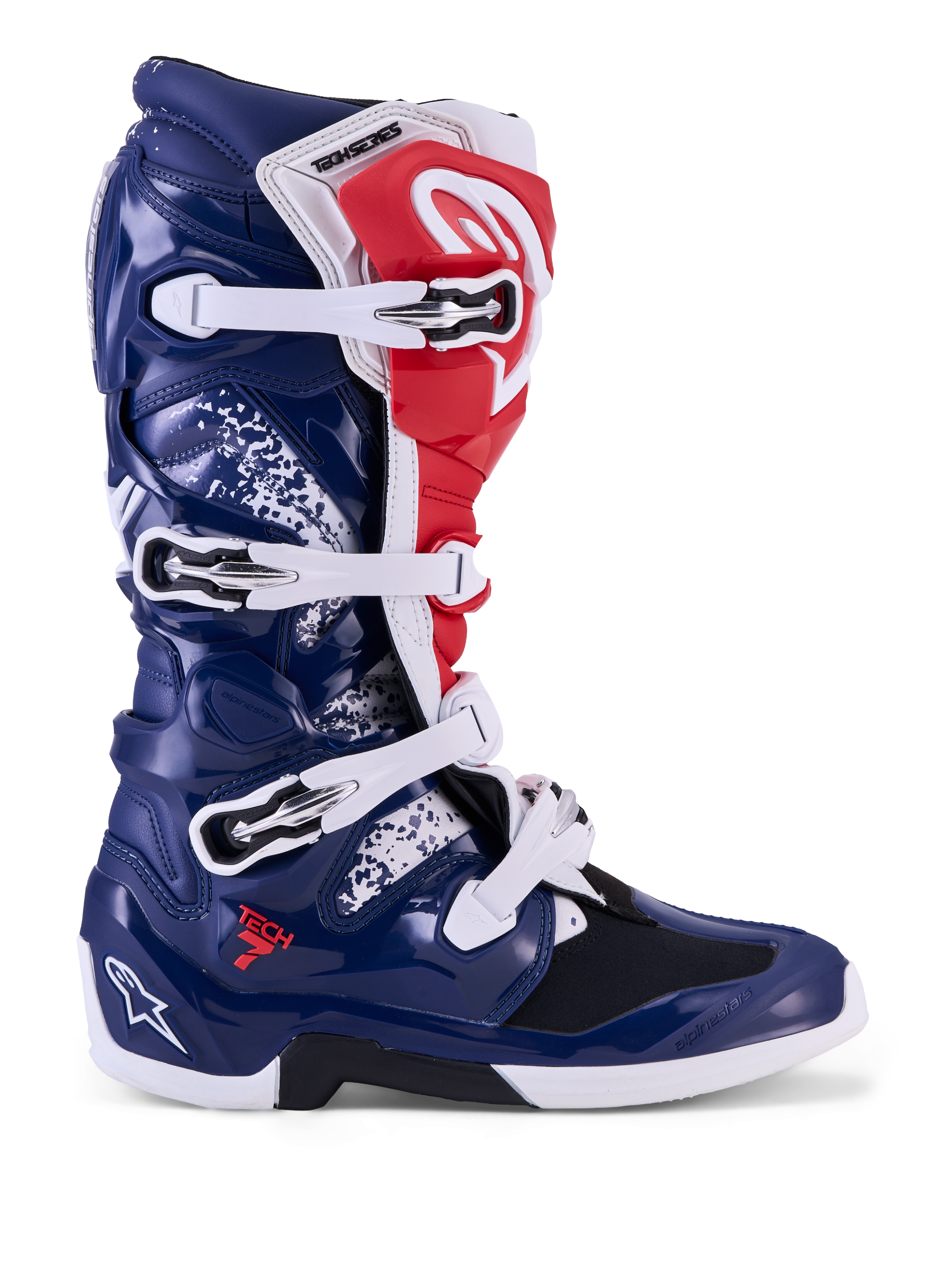 Alpinestars Tech 7 Unity, buty motocrossowe, czerwone, białe i niebieskie, z ochronną osłoną TPU i białymi klamrami.
