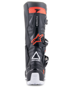 Alpinestars Tech 7 Enduro Boots, Black and Red Fluo, rear view featuring white ASTARS logo, red TPU calf protection, and white heel details, durable off-road motorcycle footwear