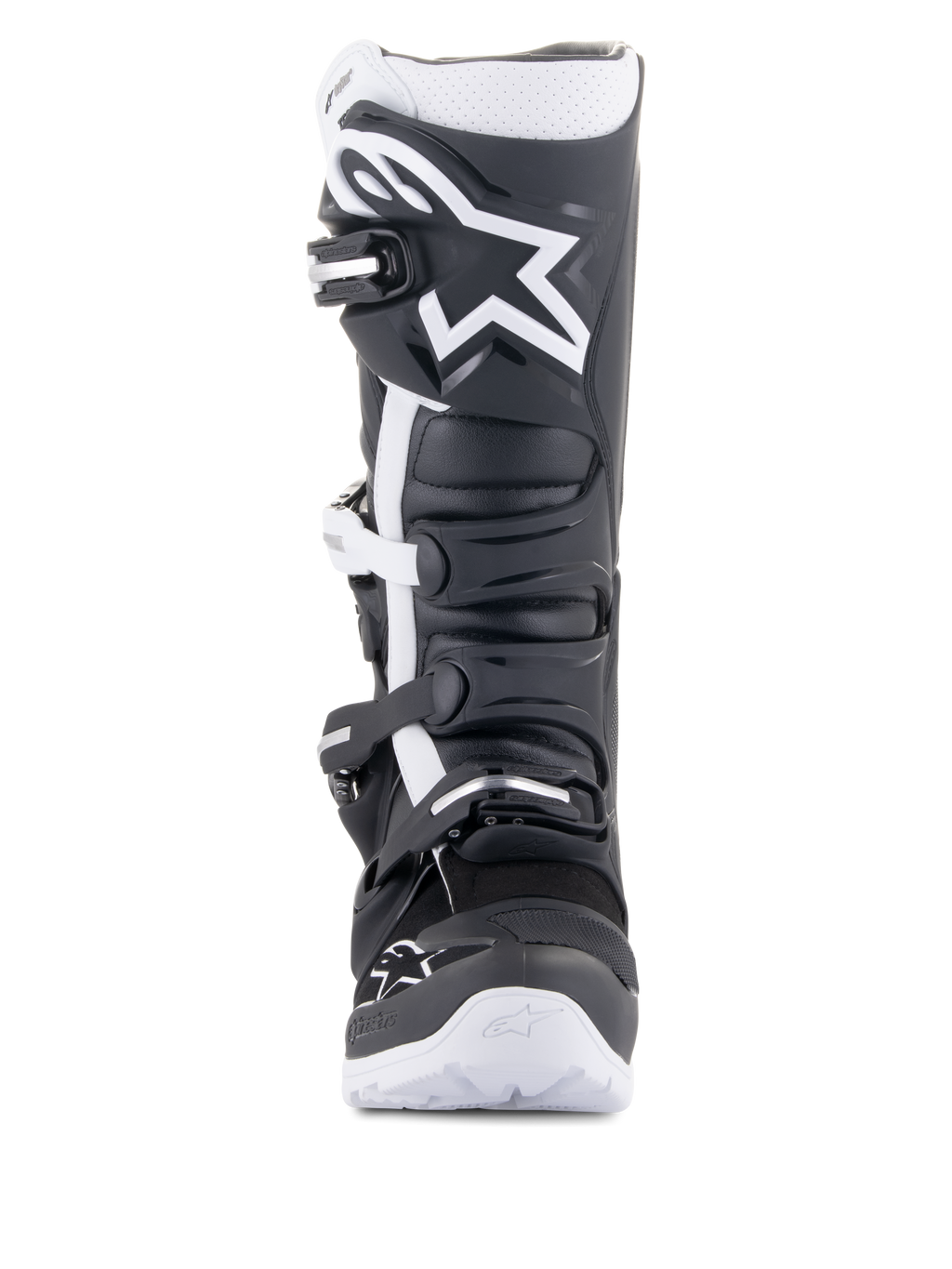 Buty Alpinestars Tech 7 Enduro Drystar®, motocyklowe buty enduro, czarno-białe, z dużym białym logo Alpinestars na nagolenniku, systemem zapięcia na cztery klamry i solidną białą podeszwą, zaprojektowane do jazdy off-road