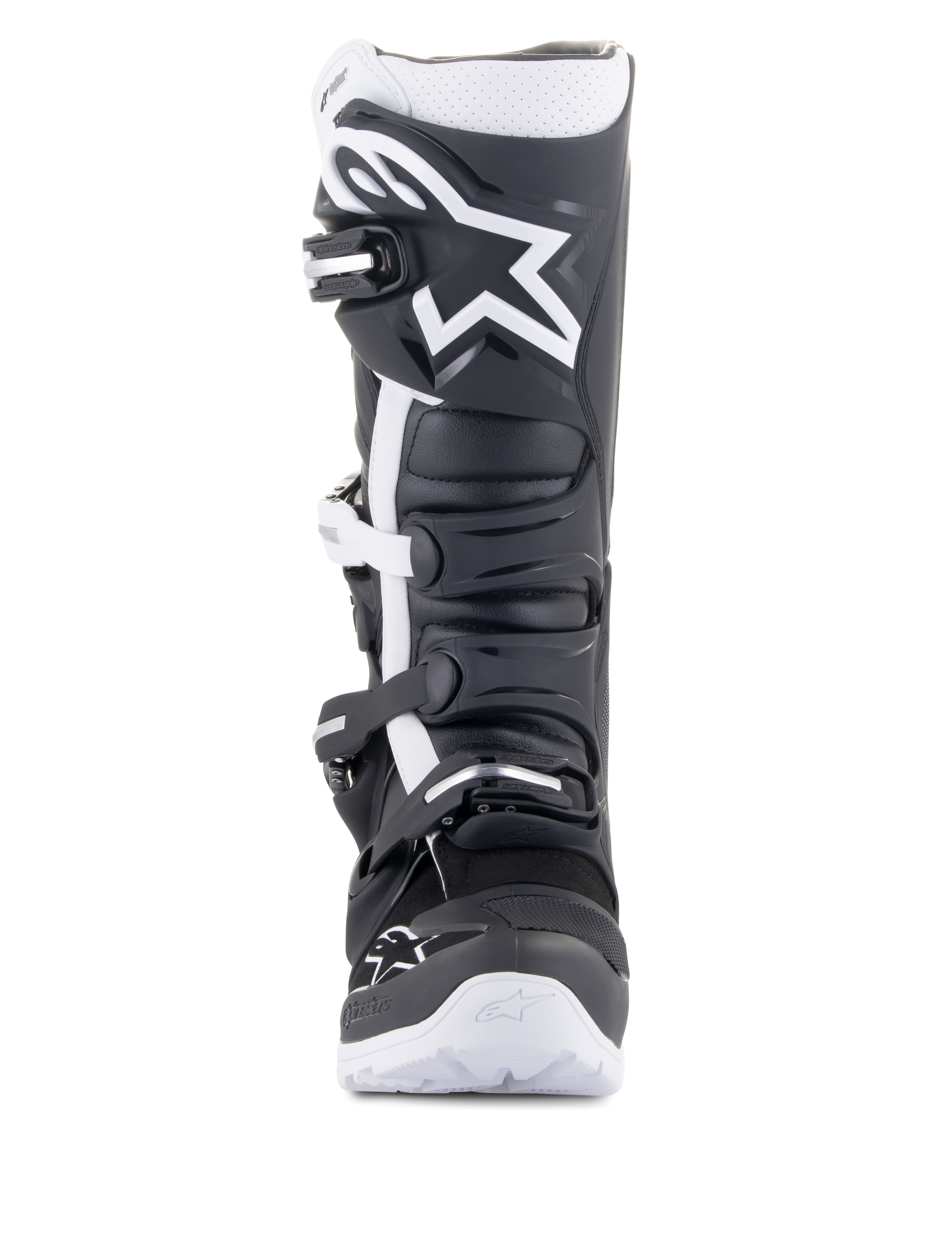 Buty Alpinestars Tech 7 Enduro Drystar®, motocyklowe buty enduro, czarno-białe, z dużym białym logo Alpinestars na nagolenniku, systemem zapięcia na cztery klamry i solidną białą podeszwą, zaprojektowane do jazdy off-road