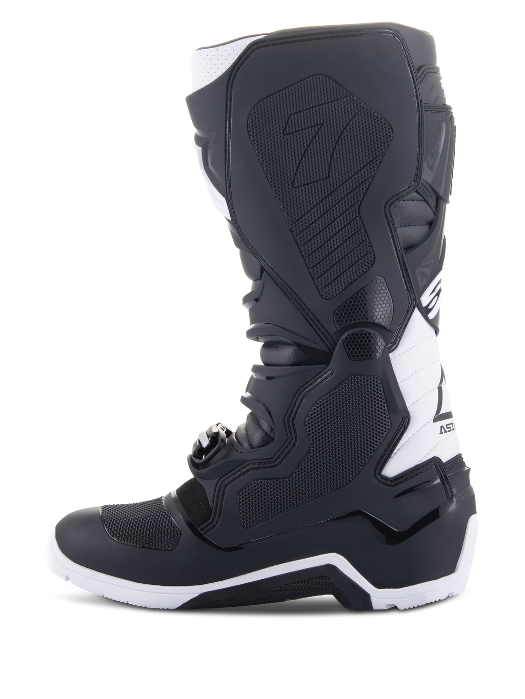 Alpinestars Tech 7 Enduro Drystar® Boots, buty motocyklowe enduro, czarno-białe, widok od strony wewnętrznej z panelami o strukturze plastra miodu zapewniającymi przyczepność, konstrukcja TPU oraz białe akcenty na pięcie i górnej części łydki, profesjonalne obuwie terenowe