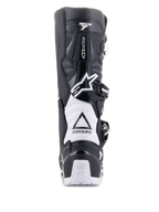 Buty Alpinestars Tech 7 Enduro Drystar, czarno-białe, widok z tyłu, ochronna konstrukcja TPU, białe elastyczne strefy harmonijkowe, system zapięć na klamry, logo Alpinestars na pięcie i cholewce