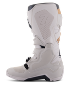 Alpinestars Tech 7 Enduro Drystar® Boots in Gray Sand, medial side view showing honeycomb-textured grip panels, light gray TPU and microfiber construction, black outsole, and waterproof membrane for off-road performance