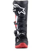 Alpinestars Honda Tech 7 Enduro Drystar Boots, Black and Bright Red, front view showing the multi-buckle closure system, large white star logo on the shin, and red sole with Honda branding, waterproof off-road motorcycle boots