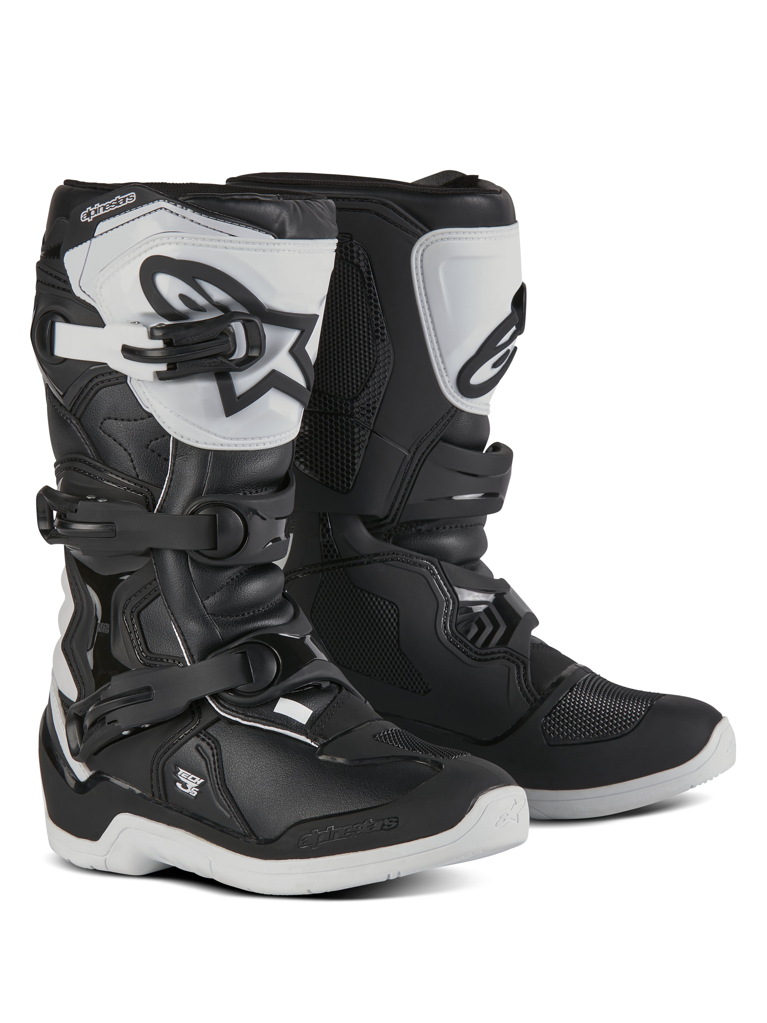 Alpinestars Youth Tech 3S Boots, Motocross Boots for young riders, Black and White, featuring three adjustable buckle straps, white TPU shin plate with Alpinestars logo, reinforced hard shell protection, and a sturdy white treaded sole, off-road racing design