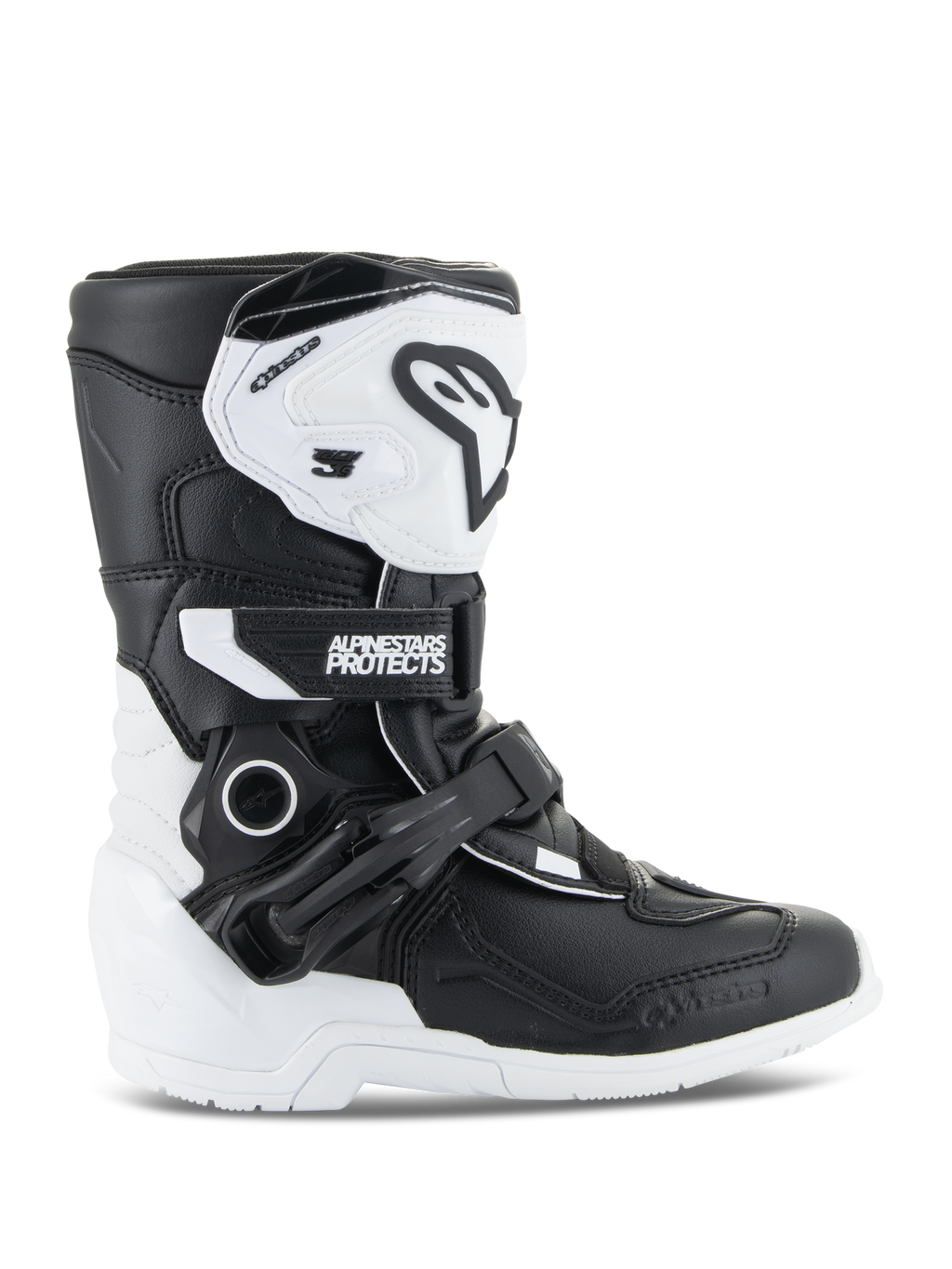 Buty Alpinestars Kids Tech 3S, młodzieżowe buty motocrossowe, biało-czarne, widok z boku prezentujący wysoką cholewkę, system zapięć na klamry i paski, ochronna płyta goleniowa TPU i biała podeszwa, obuwie motocyklowe off-road dla dzieci