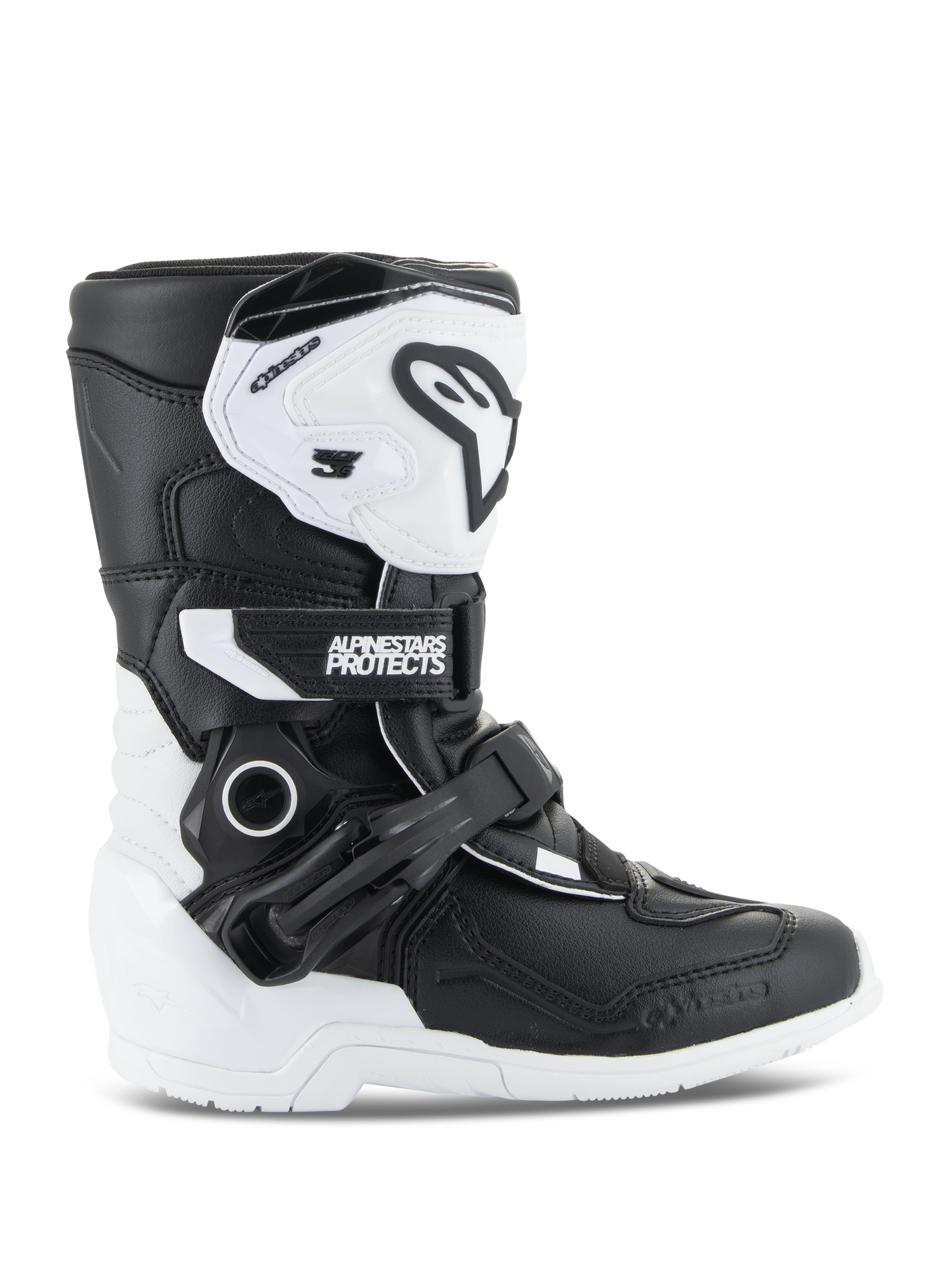 Buty Alpinestars Kids Tech 3S, młodzieżowe buty motocrossowe, biało-czarne, widok z boku prezentujący wysoką cholewkę, system zapięć na klamry i paski, ochronna płyta goleniowa TPU i biała podeszwa, obuwie motocyklowe off-road dla dzieci
