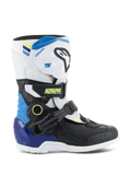 Alpinestars Kids Tech 3S Boots, dziecięce buty motocrossowe, biało-czarne z niebieskimi i żółtymi akcentami, widok z boku pokazujący ochronne paski z klamrami i wytrzymałą podeszwę, obuwie do jazdy terenowej
