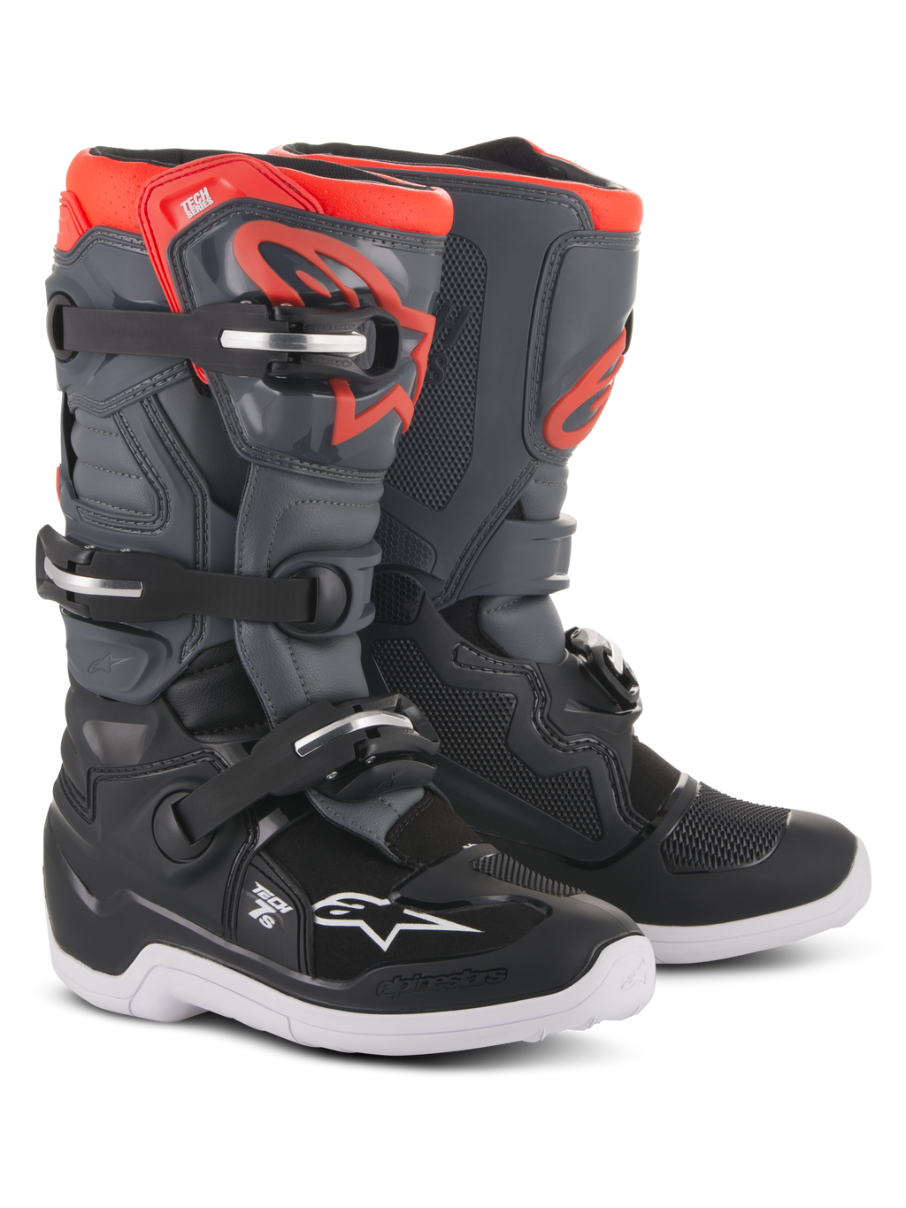 Młodzieżowe buty Alpinestars Tech 7S, buty motocrossowe, czarne, ciemnoszare i czerwone fluorescencyjne, system zapinania na cztery klamry, ochronny panel goleni TPU, biała podeszwa i czerwone logo Alpinestars, zaprojektowane dla młodych kierowców off-road.