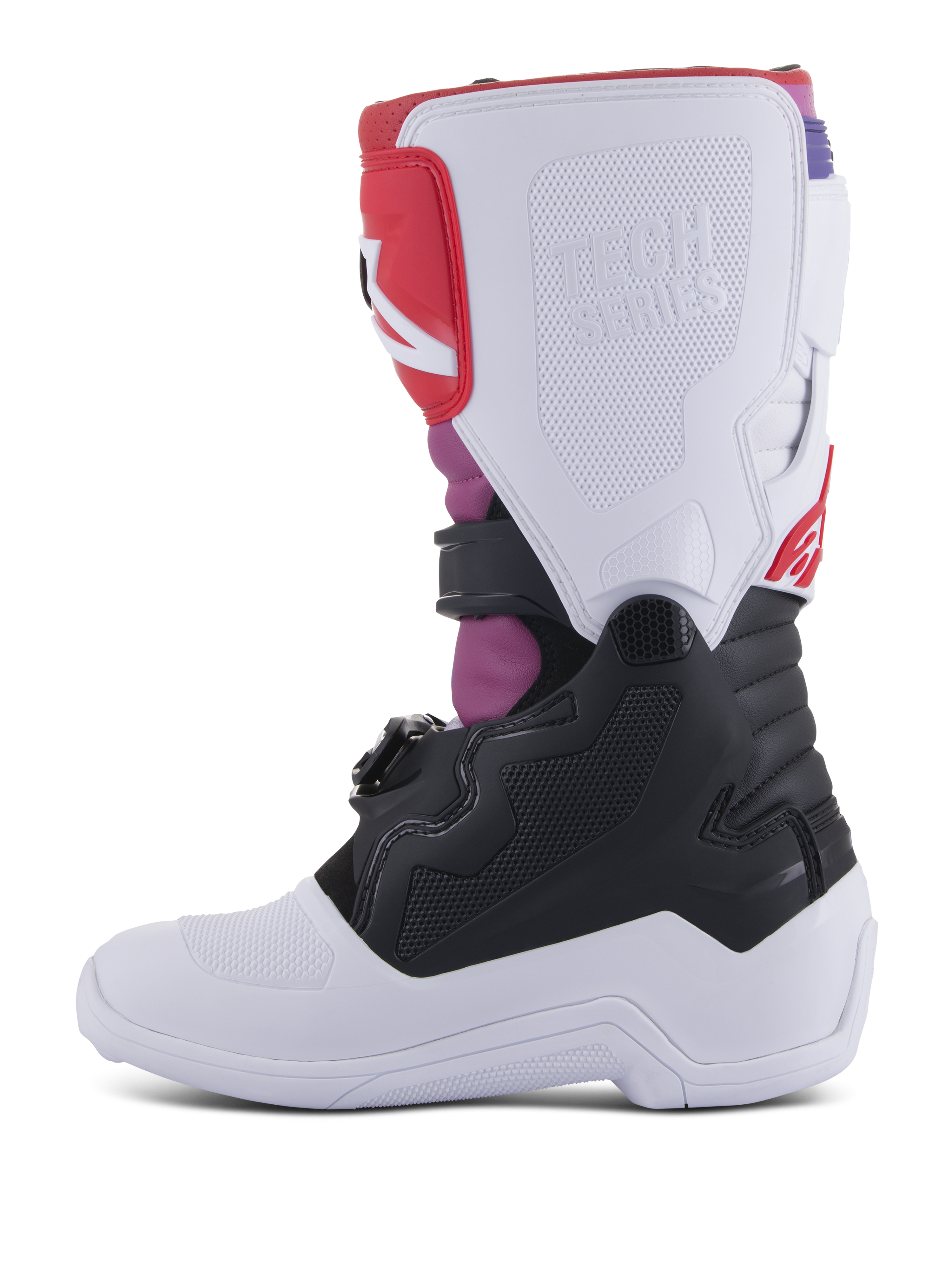 Alpinestars Youth Tech 7S Boots, buty motocrossowe, White Black Rainbow, widok od strony wewnętrznej przedstawiający białą płytę nagolenną z wytłoczonym logo Tech Series, czarną dolną część oraz jaskrawe różowe i czerwone akcenty, wytrzymały sprzęt ochronny do jazdy terenowej dla młodzieży