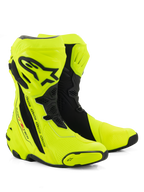 Alpinestars Supertech R Boots, buty motocyklowe wyścigowe, żółte fluo i czarne, z ochronną płytą goleniową z logo Alpinestars, elastycznymi panelami harmonijkowymi i wzmocnionymi sliderami palców, na białym tle
