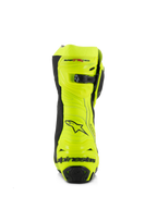 Buty Alpinestars Supertech R, wyścigowe buty motocyklowe, żółty fluo i czarny, widok z tyłu przedstawiający wzmocniony ochraniacz pięty, regulowane zapięcie łydki i wyraźne logo, fluorescencyjne wykończenie o wysokiej widoczności dla wydajności na torze i drodze