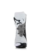 Alpinestars Supertech R Vented Boots, biało-szaro-czarne, widok z tyłu ukazujący perforowaną konstrukcję z mikrofibry, przeprojektowana szara płyta pięty o strukturze plastra miodu, wyraźne czarne logo na górnej części łydki, profesjonalne obuwie motocyklowe wyścigowe i sportowe