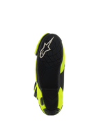 Alpinestars Supertech R Vented Boots, widok od spodu przedstawiający czarną gumową podeszwę, teksturowany wzór przyczepności na podnóżki, białe logo A-star, wyścigowe buty motocyklowe w kolorze żółtym fluo i czarnym