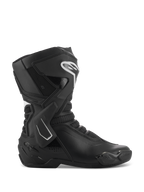 Buty Alpinestars Stella SMX-6 V3, damskie motocyklowe buty sportowe, czarno-białe, widok z boku przedstawiający stabilizator kostki TPU i ochraniacz goleni, oddychające panele z siatki, białe logo Alpinestars z przodu, zaprojektowane do jazdy na torze i ulicy