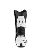 Buty Alpinestars SMX S, czarno-białe, widok z tyłu ukazujący biały ochraniacz pięty z czarnym logo gwiazdy, żebrowane elastyczne panele harmonijkowe oraz białe wzmocnienie górnej części łydki, trwałe sportowe buty motocyklowe z mikrofibry