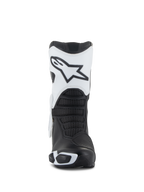 Buty Alpinestars Stella SMX-6 V3 Drystar®, damskie buty motocyklowe, biało-czarne, widok z przodu prezentujący biały ochraniacz goleni z logo Astars, czarne teksturowane strefy zgięcia i ochronne elementy TPU do jazdy wyczynowej.