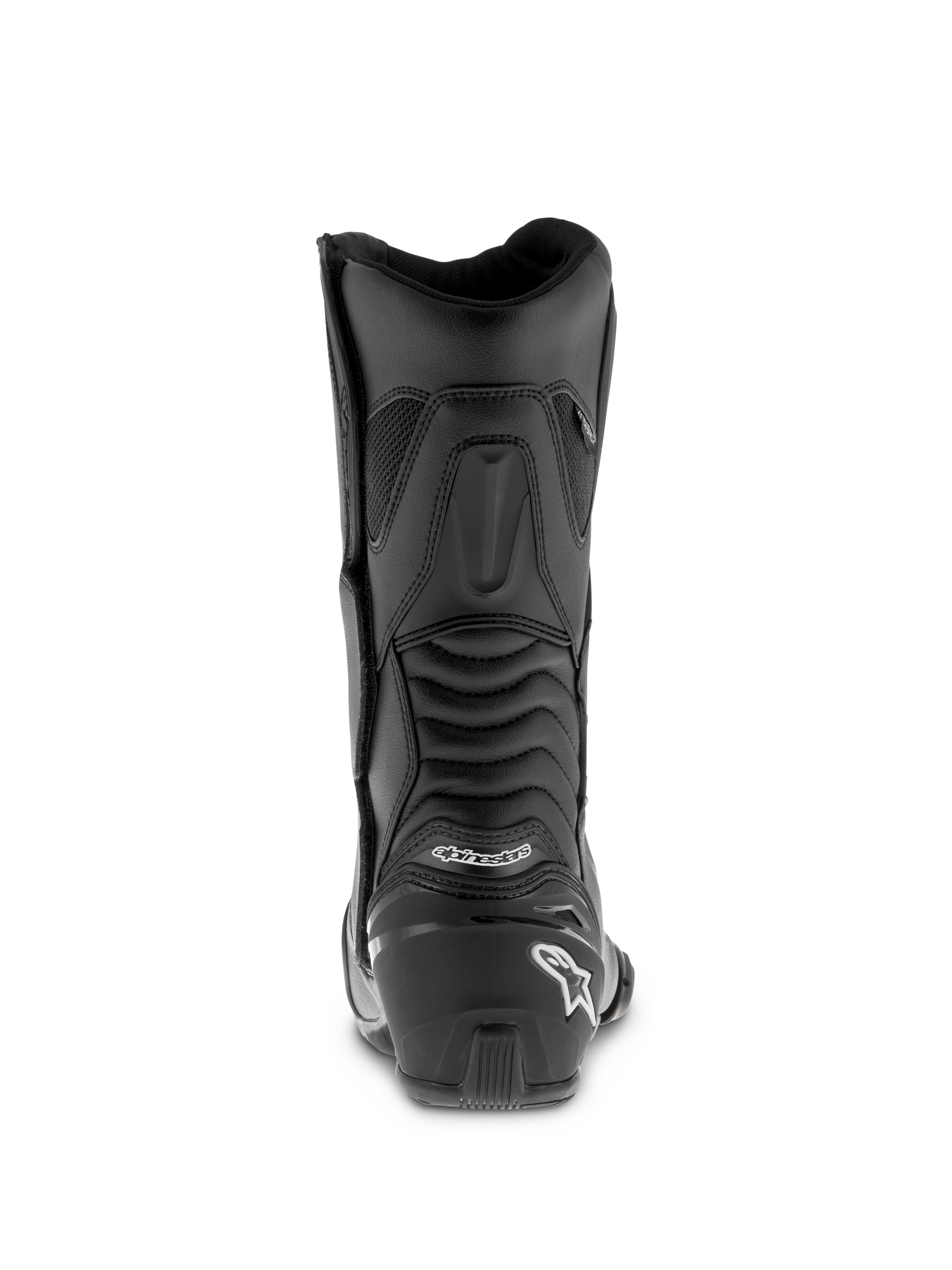 Alpinestars SMX S Waterproof Boots, czarne buty motocyklowe, profil z tyłu z wzmocnionym ochraniaczem pięty i białym logo, żebrowane elastyczne panele harmonijkowe zwiększające ruchomość kostki, wytrzymała konstrukcja z mikrofibry do jazdy sportowo-turystycznej