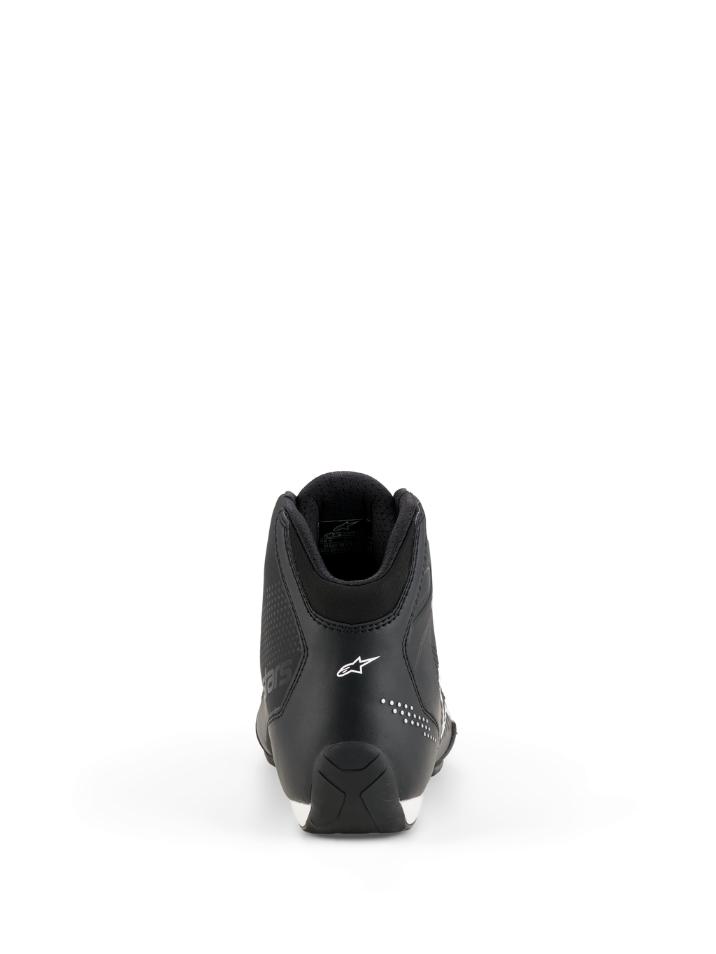 Buty Alpinestars Celer, buty motocyklowe, czarno-białe, widok z tyłu przedstawiający konstrukcję pięty, białe logo gwiazdy Alpinestars, mikroperforowane detale i teksturowana gumowa podeszwa do sportowej jazdy